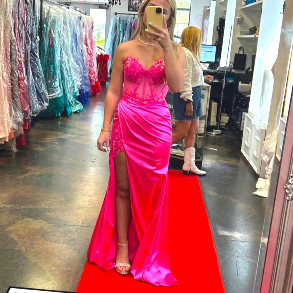 Brand new still has tags. Hot pink prom dress size 0